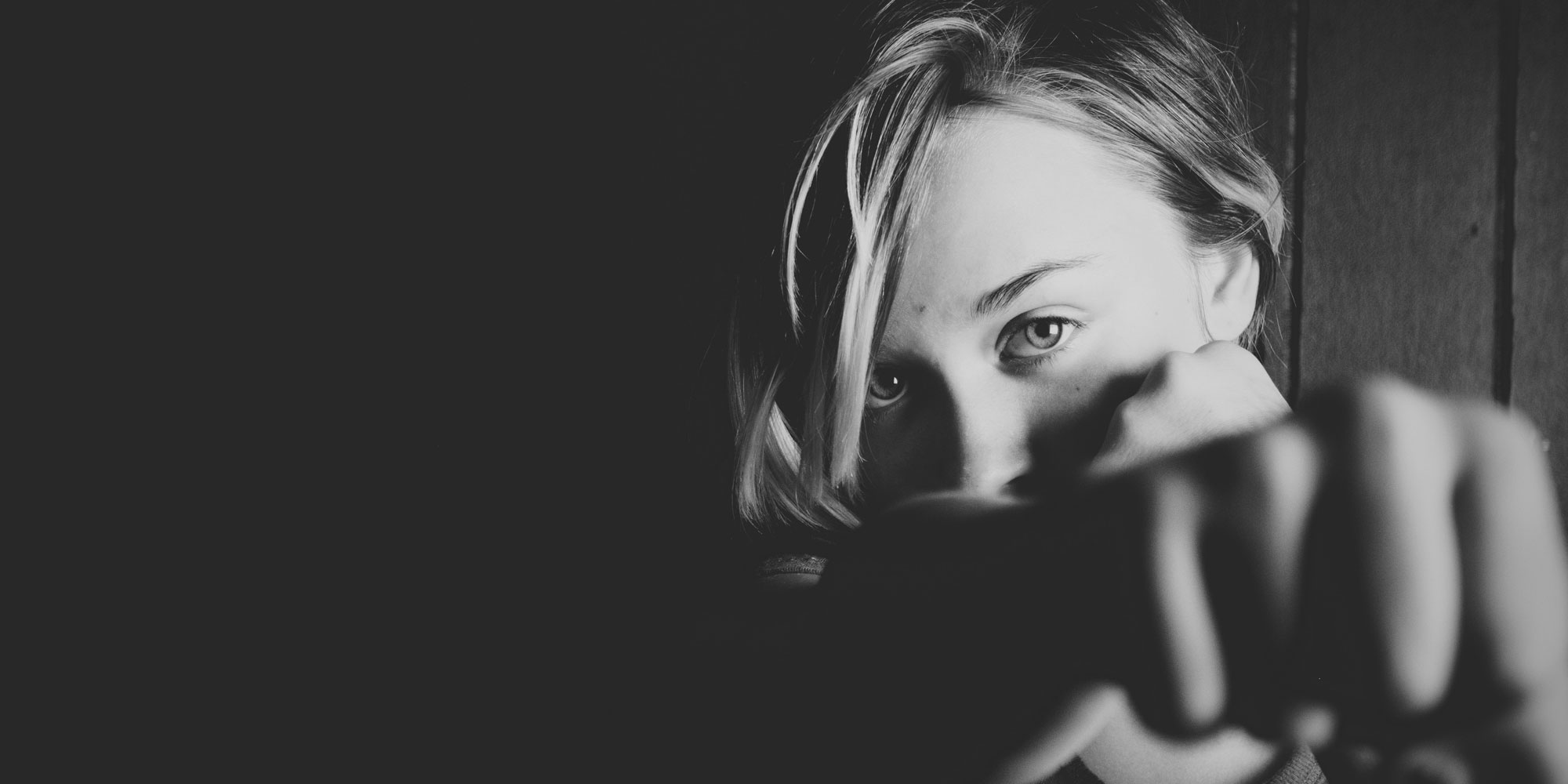 Woman punching with confidence