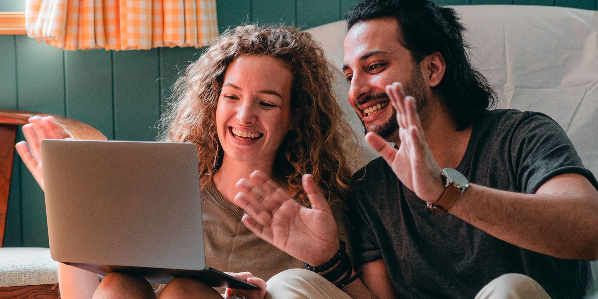 couple being playful on a video call during COVID