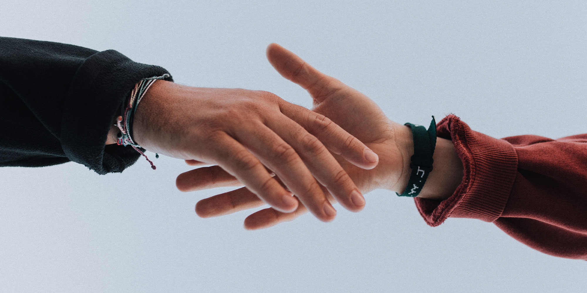 two hands reaching out toward each other